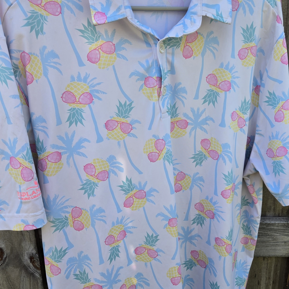 Vibrant Pink and Yellow Polo Shirt with Retro Floral Pattern